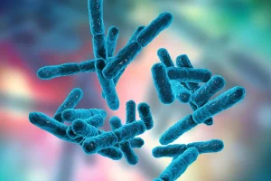 Een 3D-weergave van probiotische bacteriestammen in het blauw, zwevend tegen een vervaagde, kleurrijke achtergrond.
