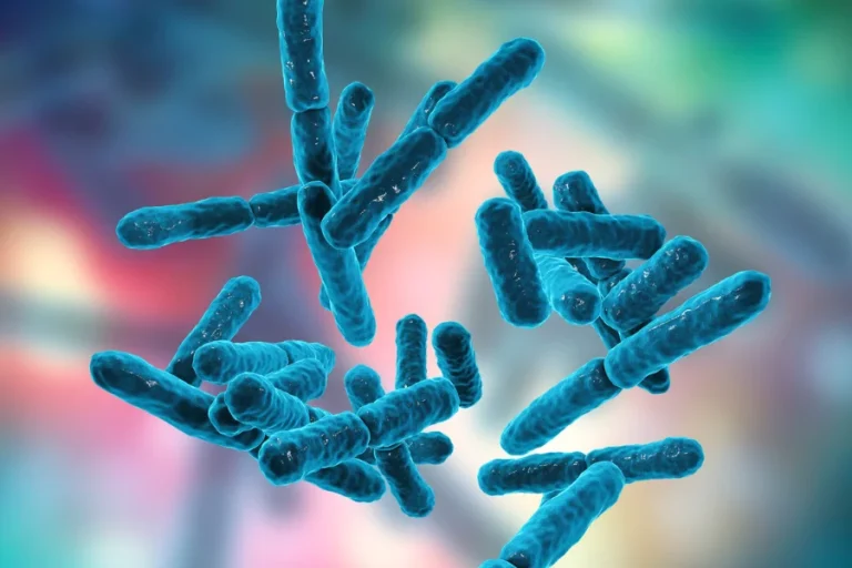 Een 3D-weergave van probiotische bacteriestammen in het blauw, zwevend tegen een vervaagde, kleurrijke achtergrond.